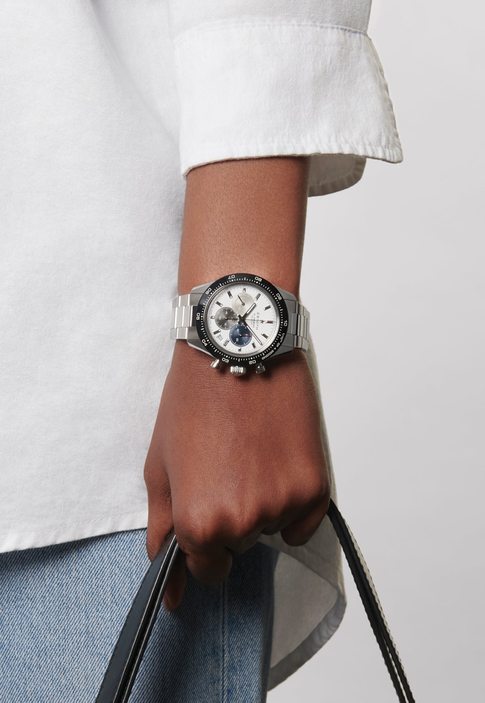 Zenith Chronomaster Sport worn with a white shirt and blue jeans.